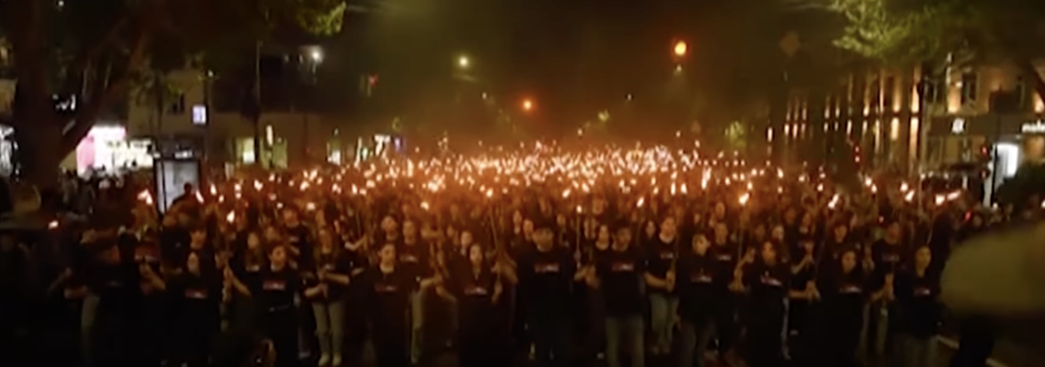 Armenians march through Yerevan holding torches (AP Archive/YouTube)